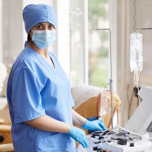 nurse-working-with-medical-equipment-SDLQ8CC.jpg